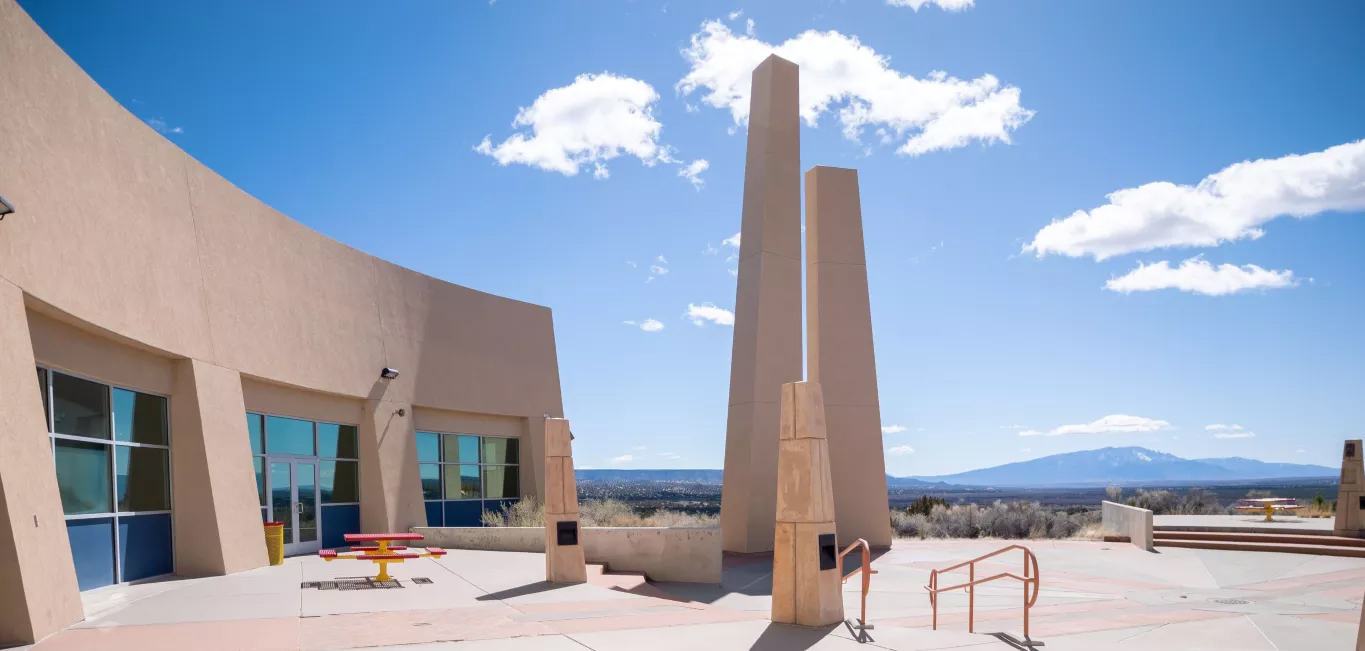 T'siya Day School exterior with pillars on a sunny day