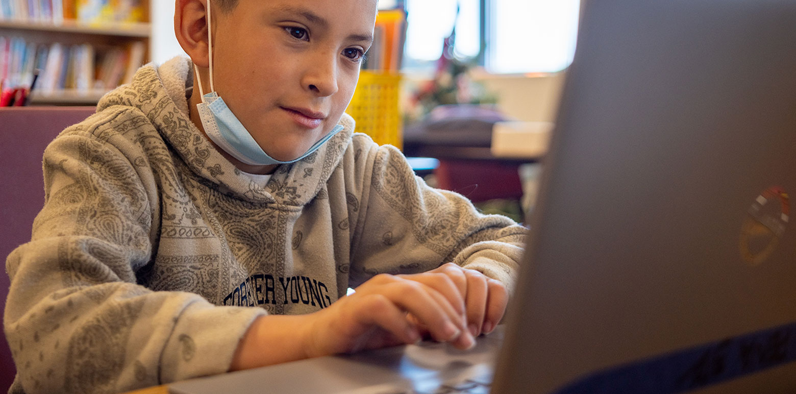 Student using a computer during class. 