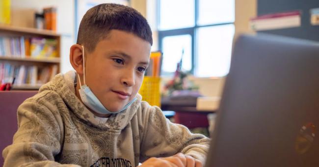 student working on computer